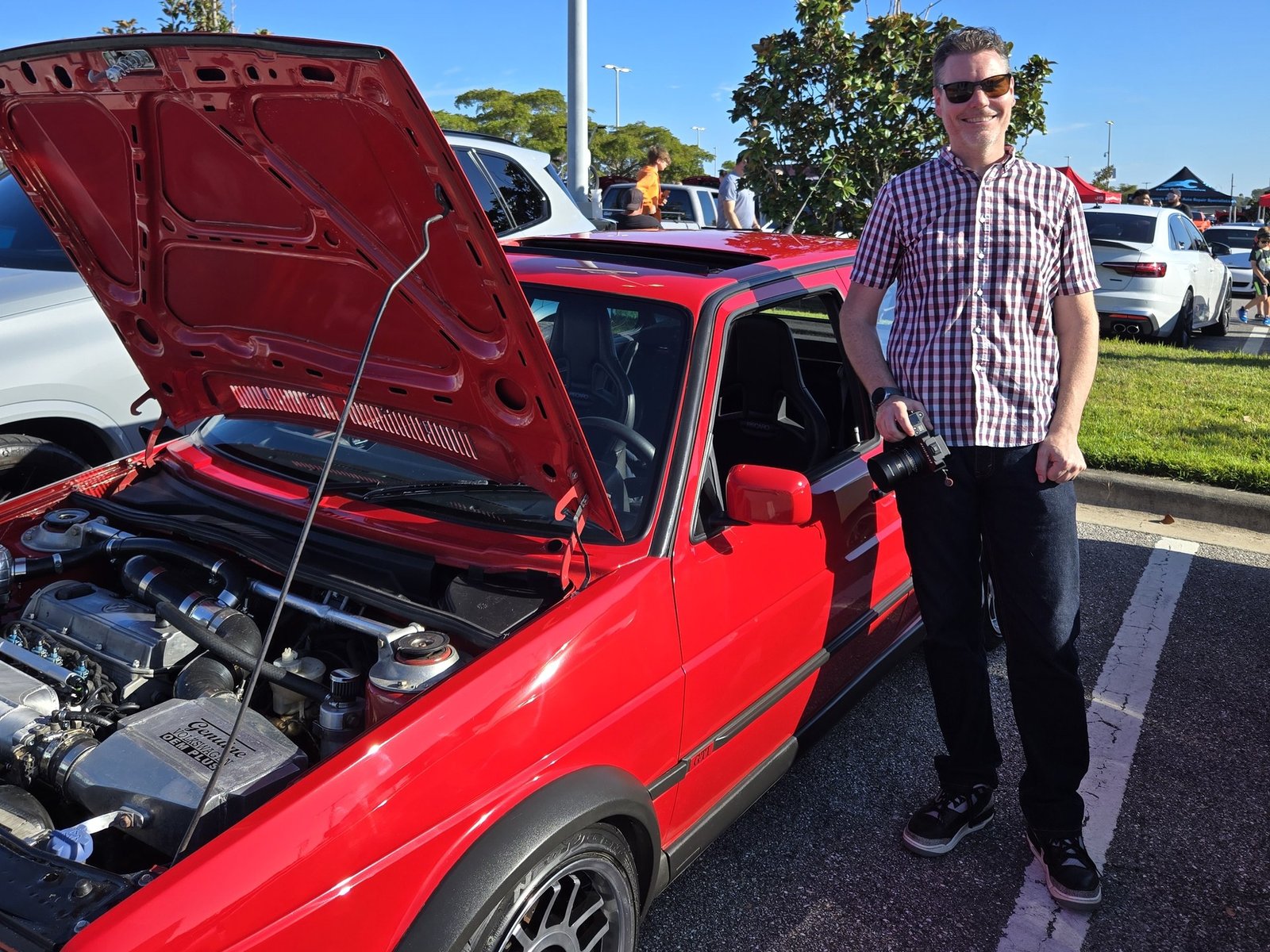 Nicholas James Bath with his fully restored Tornado Red Volkswagen Mk2 GTI